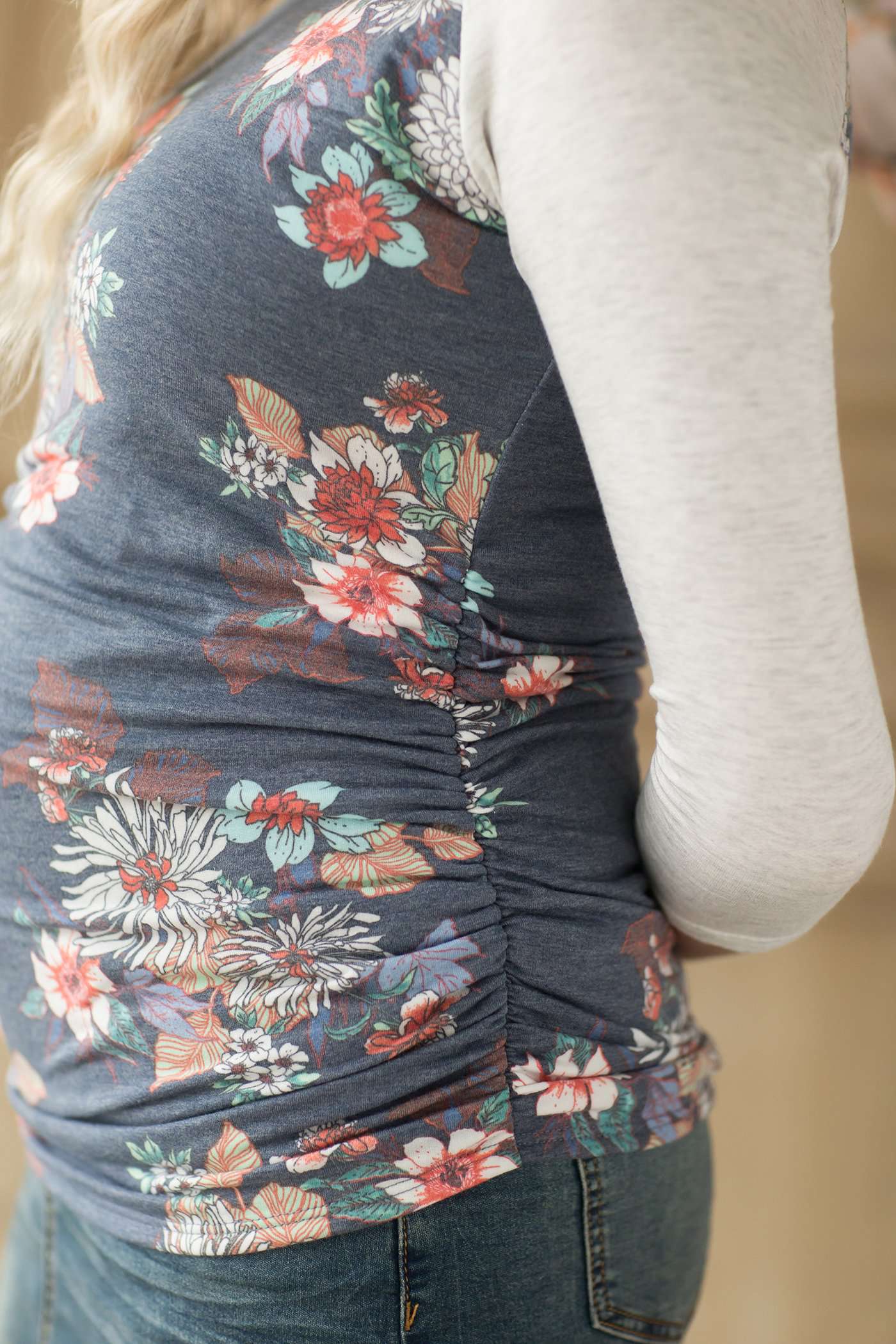 Maternity gathered sides on this navy floral top with light grey 3/4 length sleeves.