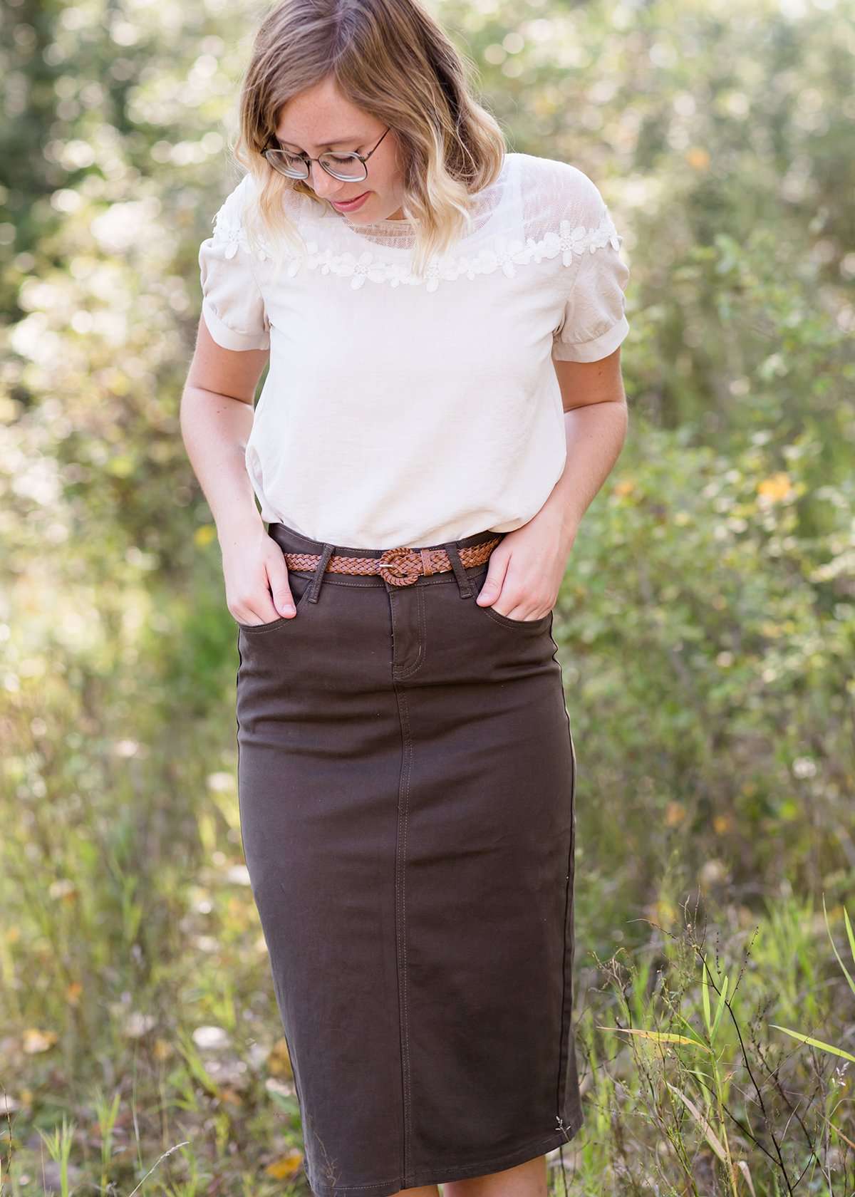 A 43 inch long, 100% leather brown braided belt.