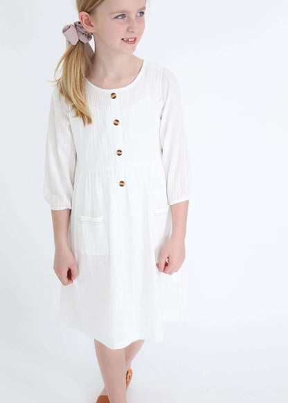 modest girls white peasant dress with pockets and buttons