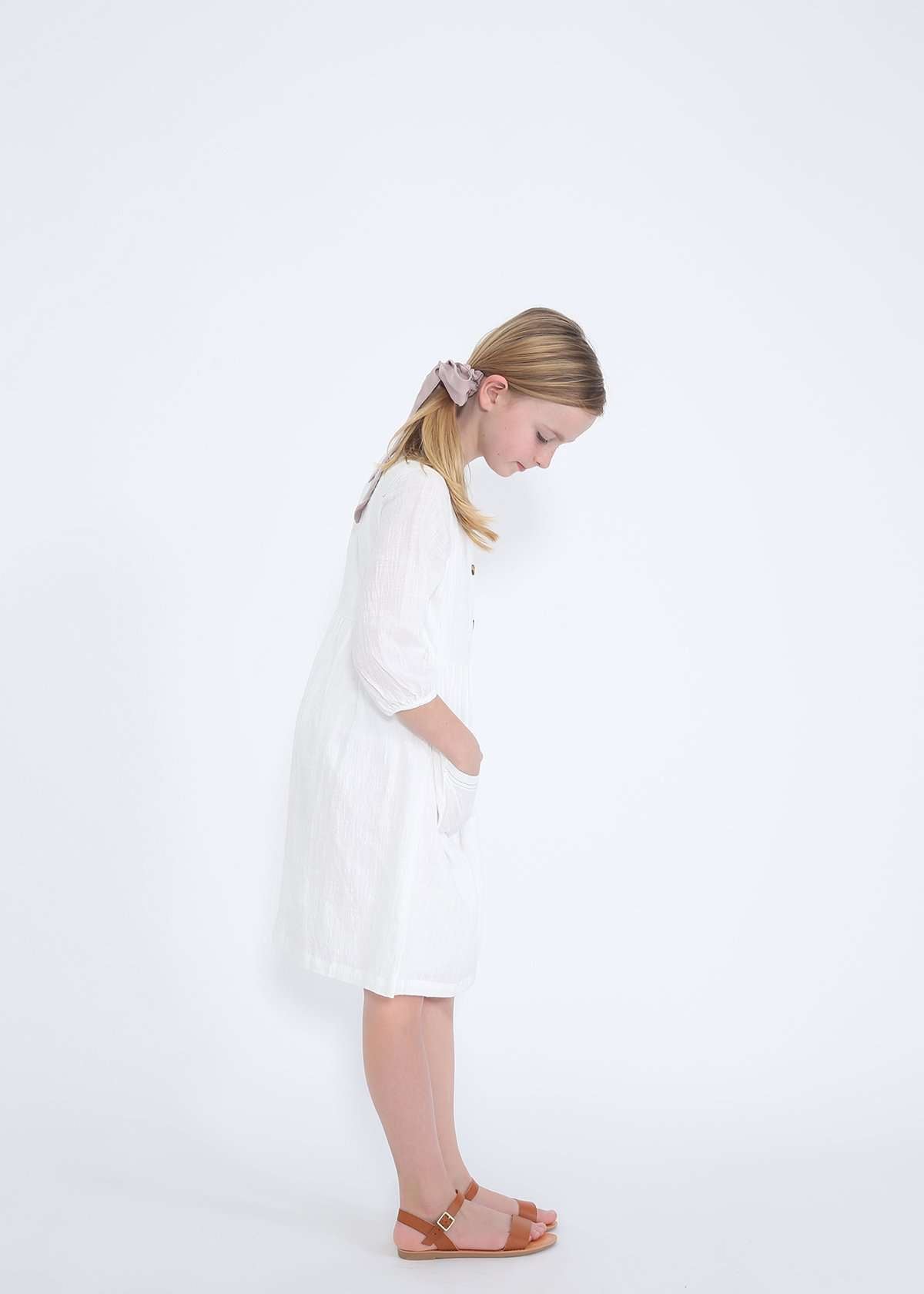 modest girls white peasant dress with pockets and buttons