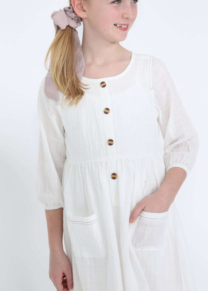 modest girls white peasant dress with pockets and buttons