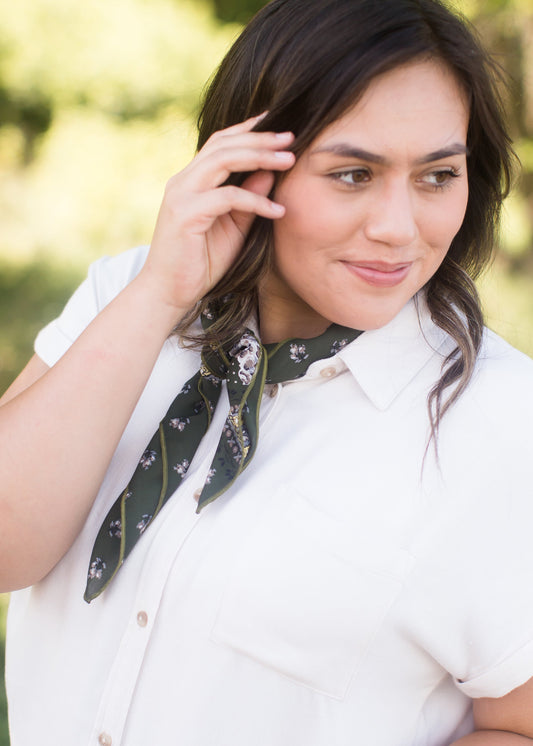 Natural cream colored button front pocket top