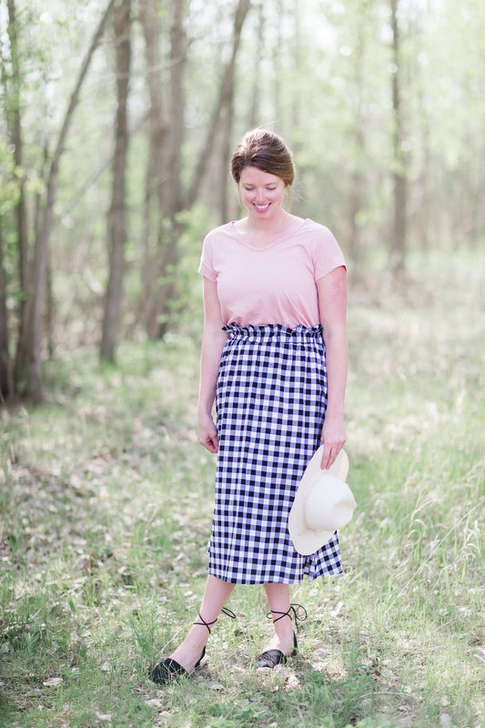 Black and white checkered below the knee skirt with elastic ruffle waistband.