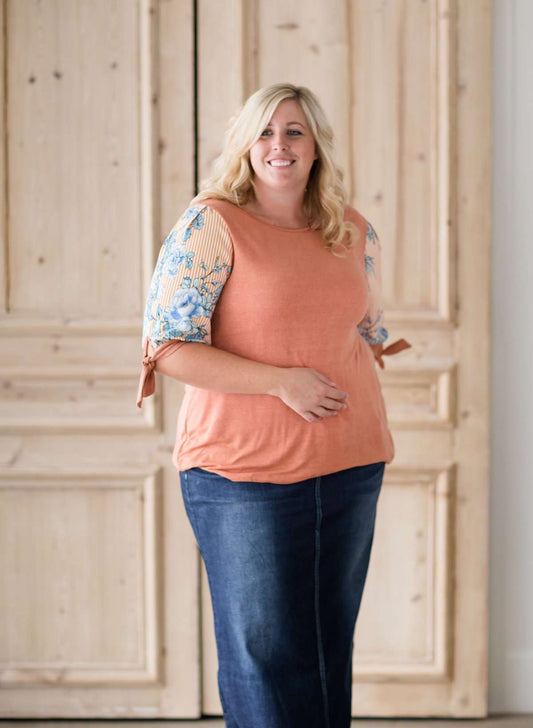 cork colored plus size modest top with floral tie sleeves.