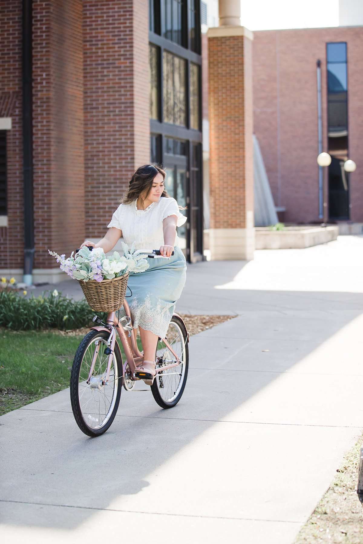 Woman wearing a mint green cotton midi skirt with a self tie and feminine crochet lace detail at the bottom hem