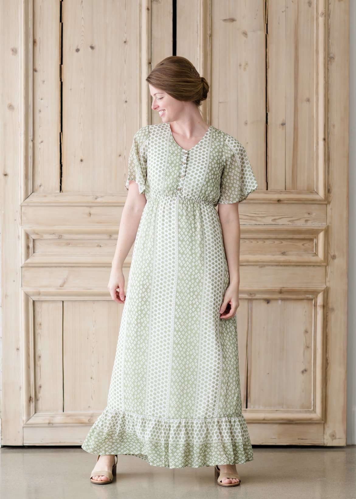 Green polka dot ditsy print maxi dress with flutter sleeves and faux button front