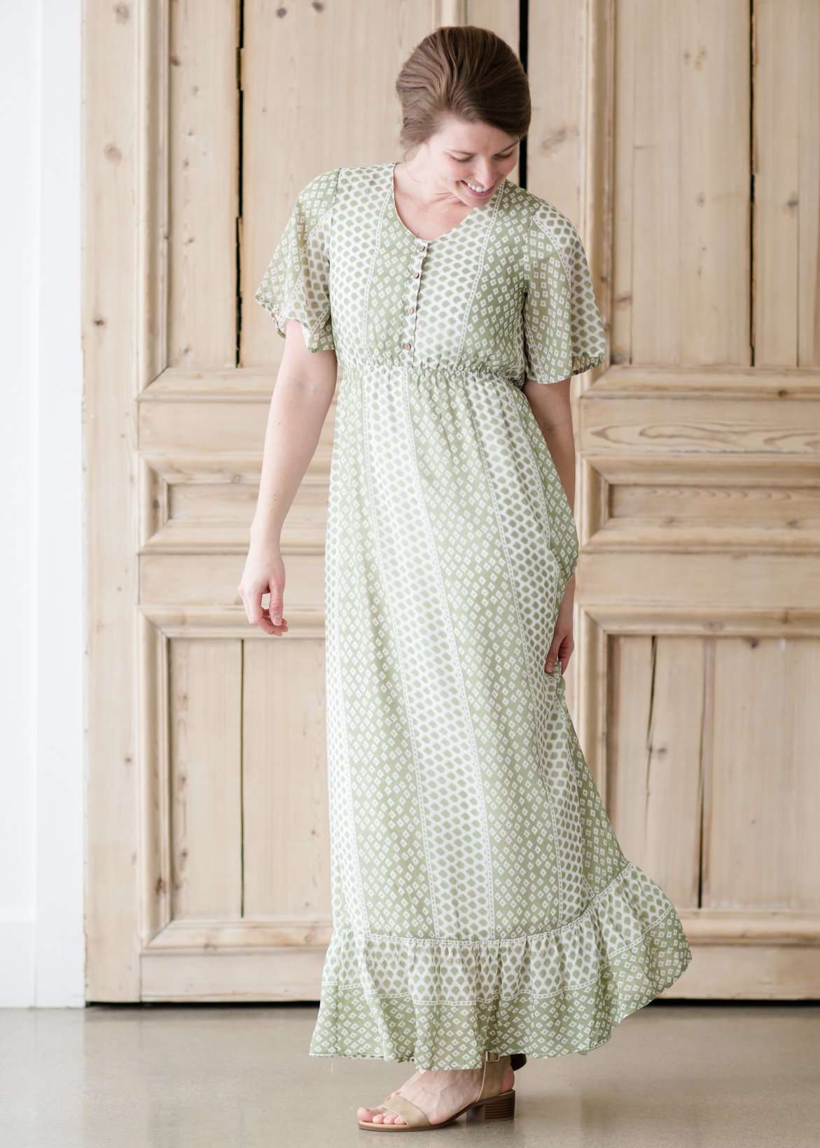 Green polka dot ditsy print maxi dress with flutter sleeves and faux button front