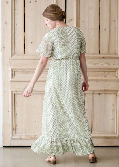 Green polka dot ditsy print maxi dress with flutter sleeves and faux button front