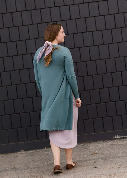 jade colored long double pocket button up cardigan