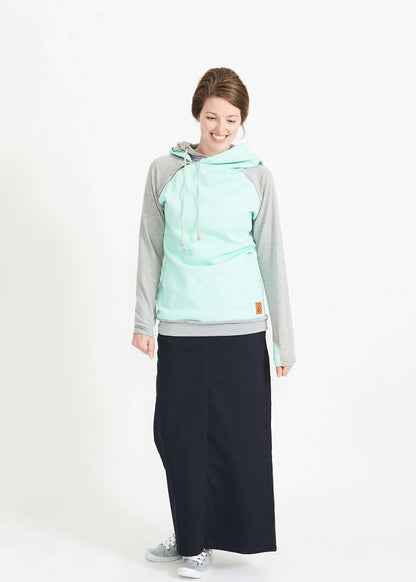 Woman wearing a mint and gray doublehood sweatshirt from ampersand avenue