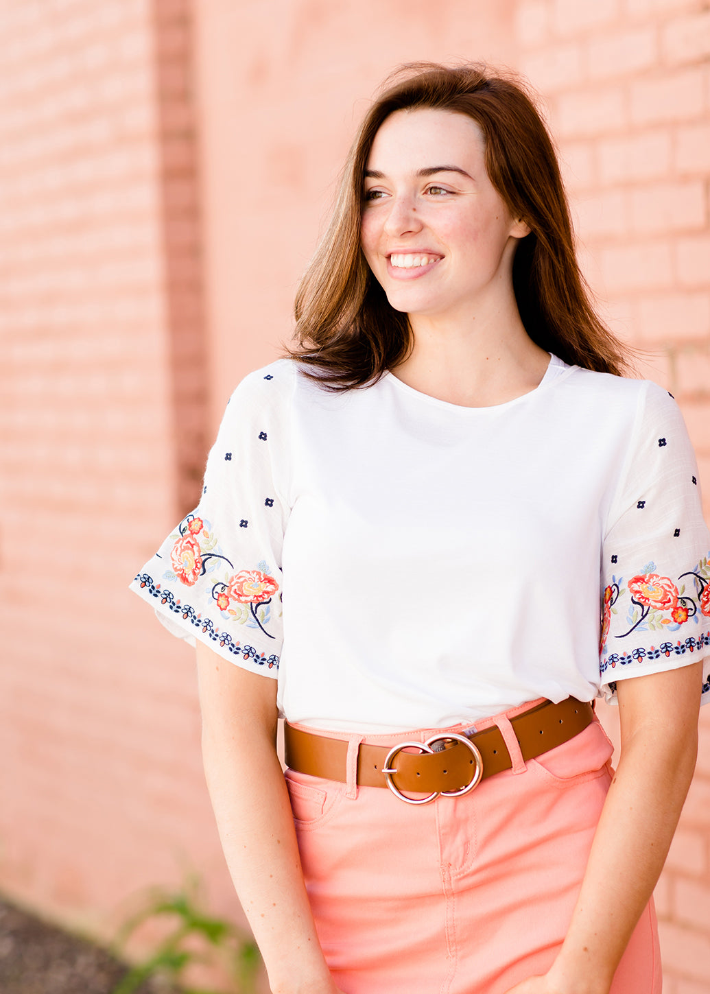 White top with multi color floral embroidered knit sleeves