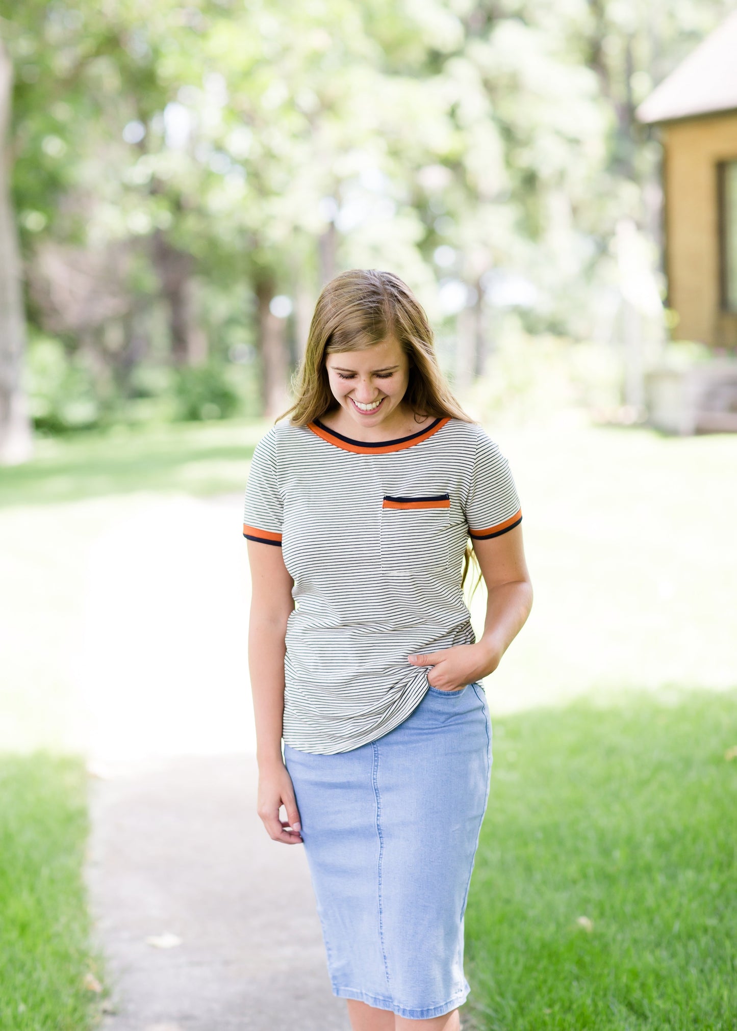 Navy striped tee with a rust accent and front pocket