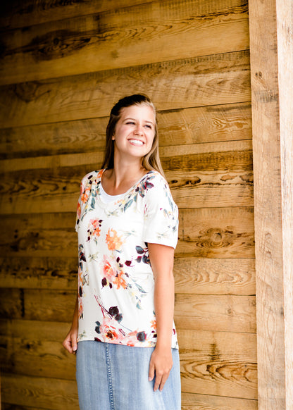 Modest cream tee with multi-colored floral detail 