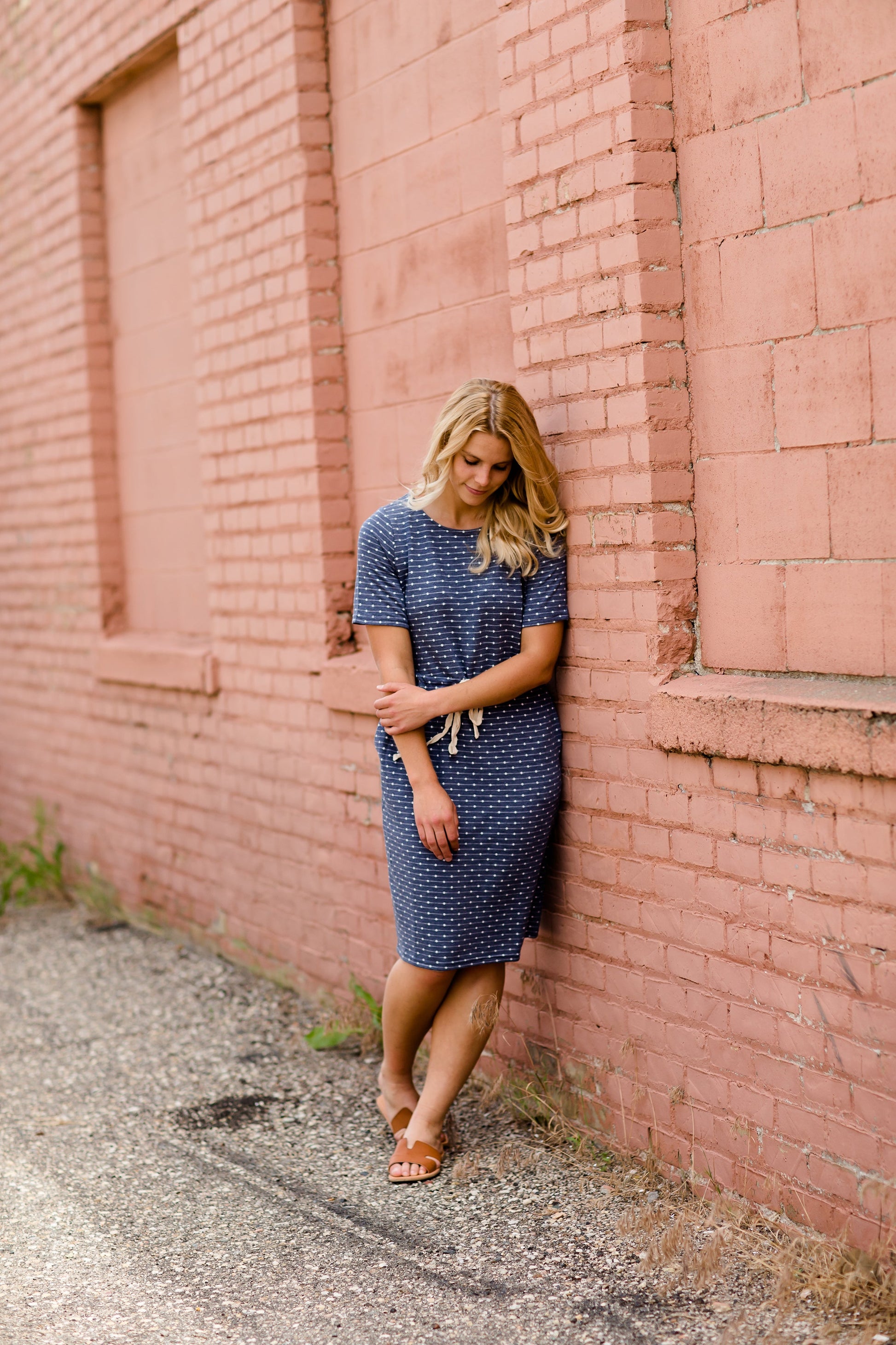 Navy dot knit midi dress with pockets and an adjustable waist