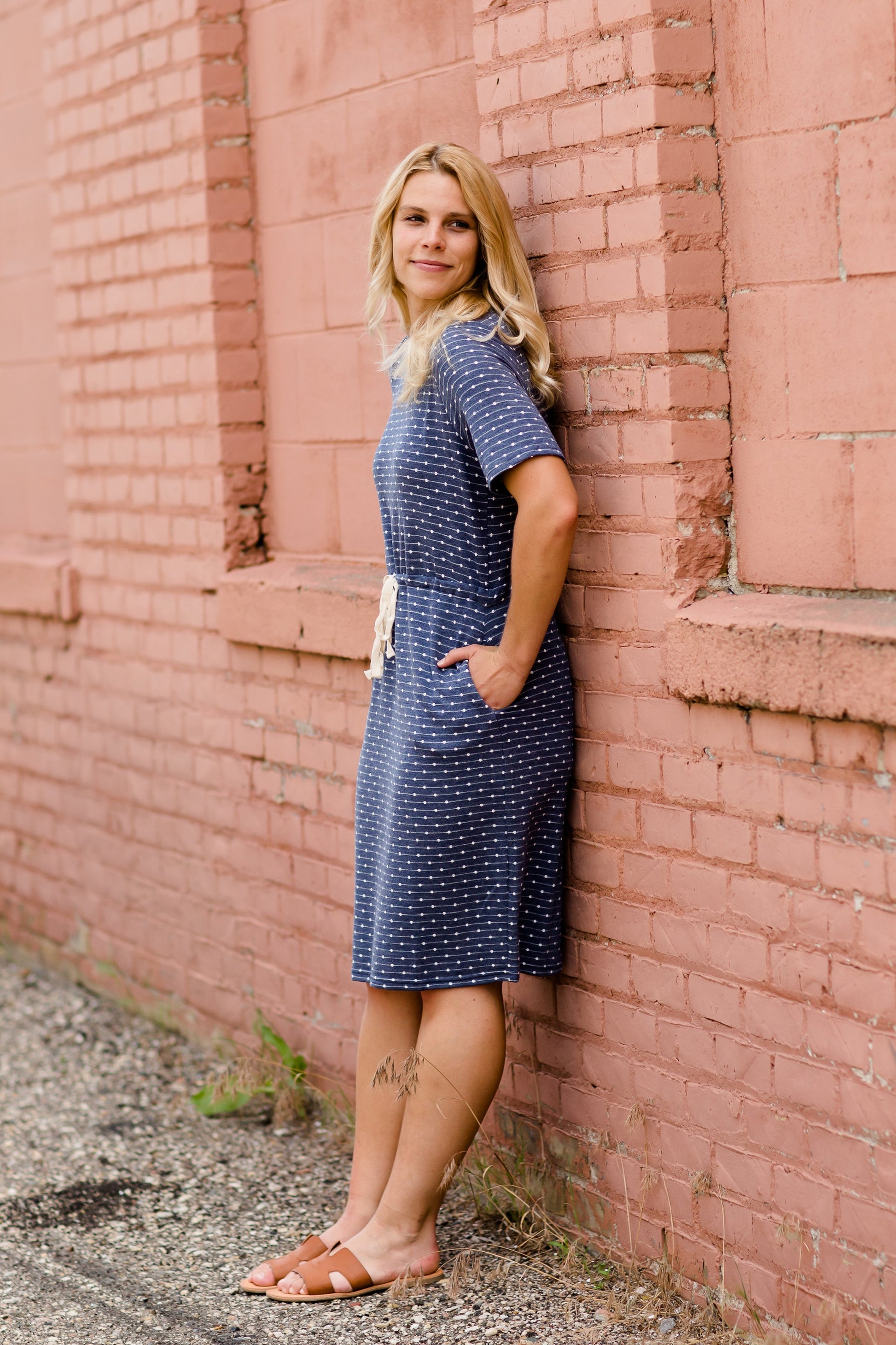 Navy dot knit midi dress with pockets and an adjustable waist