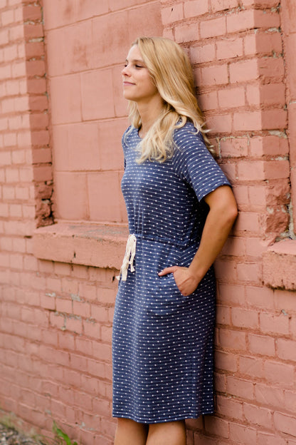 Navy dot knit midi dress with pockets and an adjustable waist