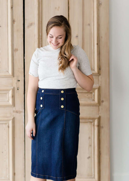 woman wearing a gray mock neck short sleeve top