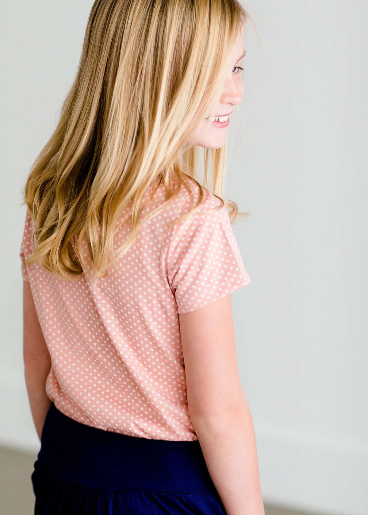 Girls modest blush polka dot tee with a ruffle front pocket