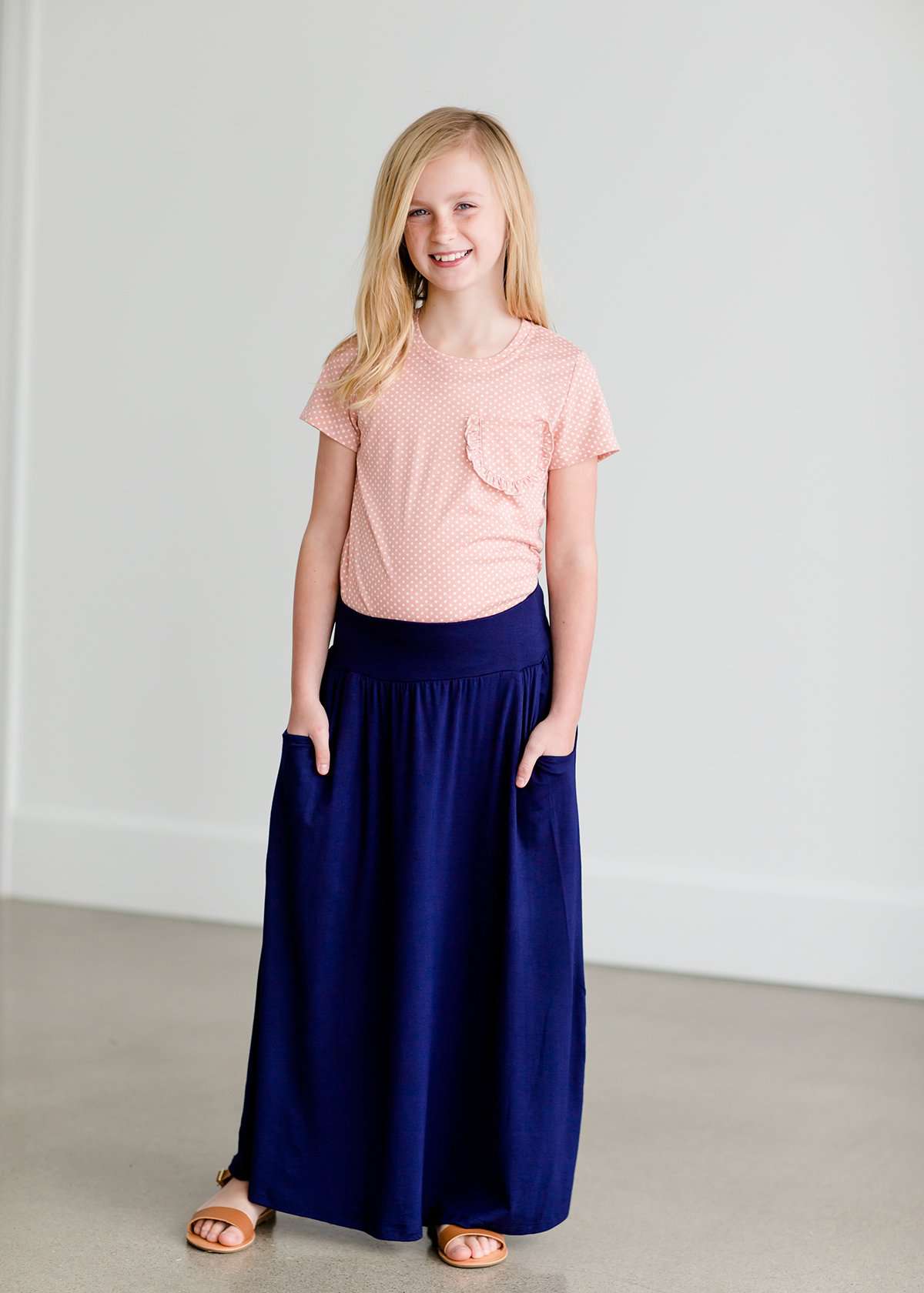 Girls modest blush polka dot tee with a ruffle front pocket